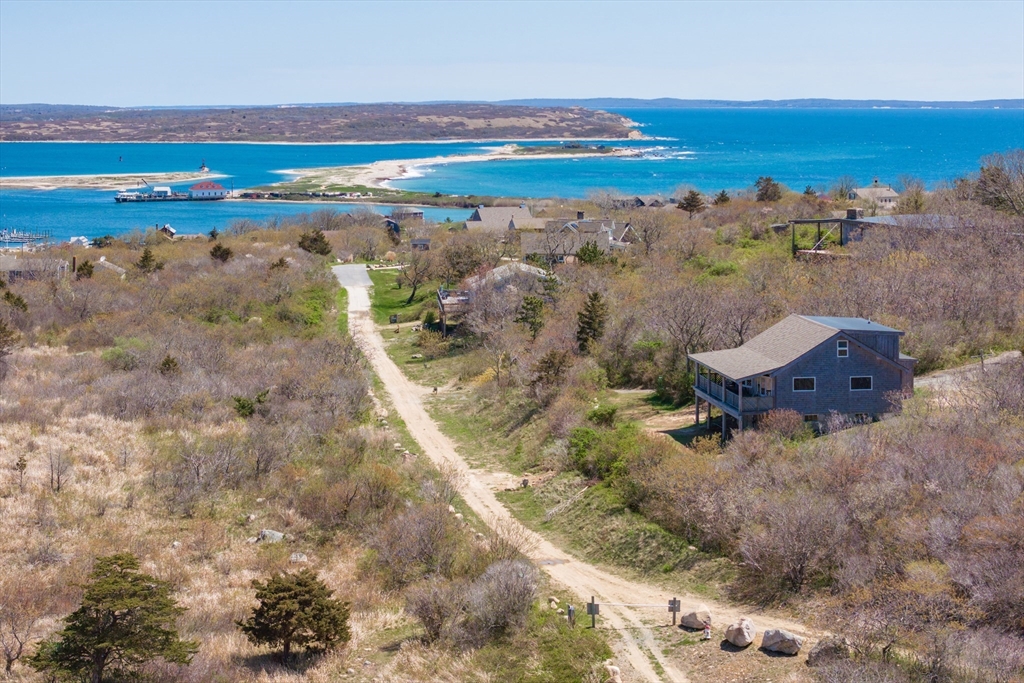 0 Bayberry Hill Road Cuttyhunk, MA 02713 - Photo 12 of 12 a view of an ocean beach and a mountain view