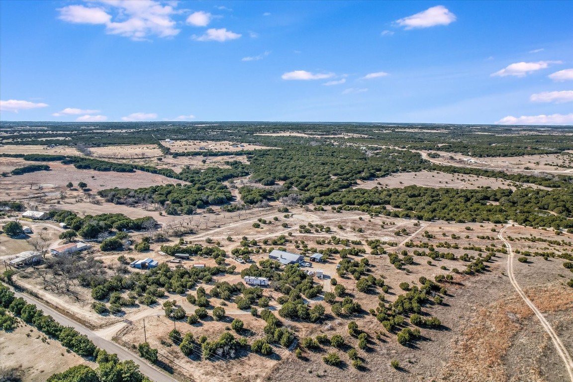 Birds eye view of property featuring a rural view