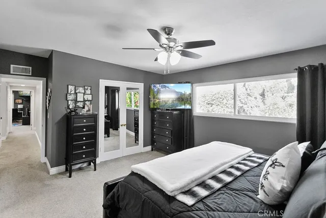 a bed room with a bed and a television