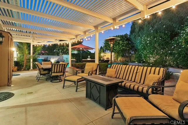 an aerial view of a house roof deck and outdoor seating