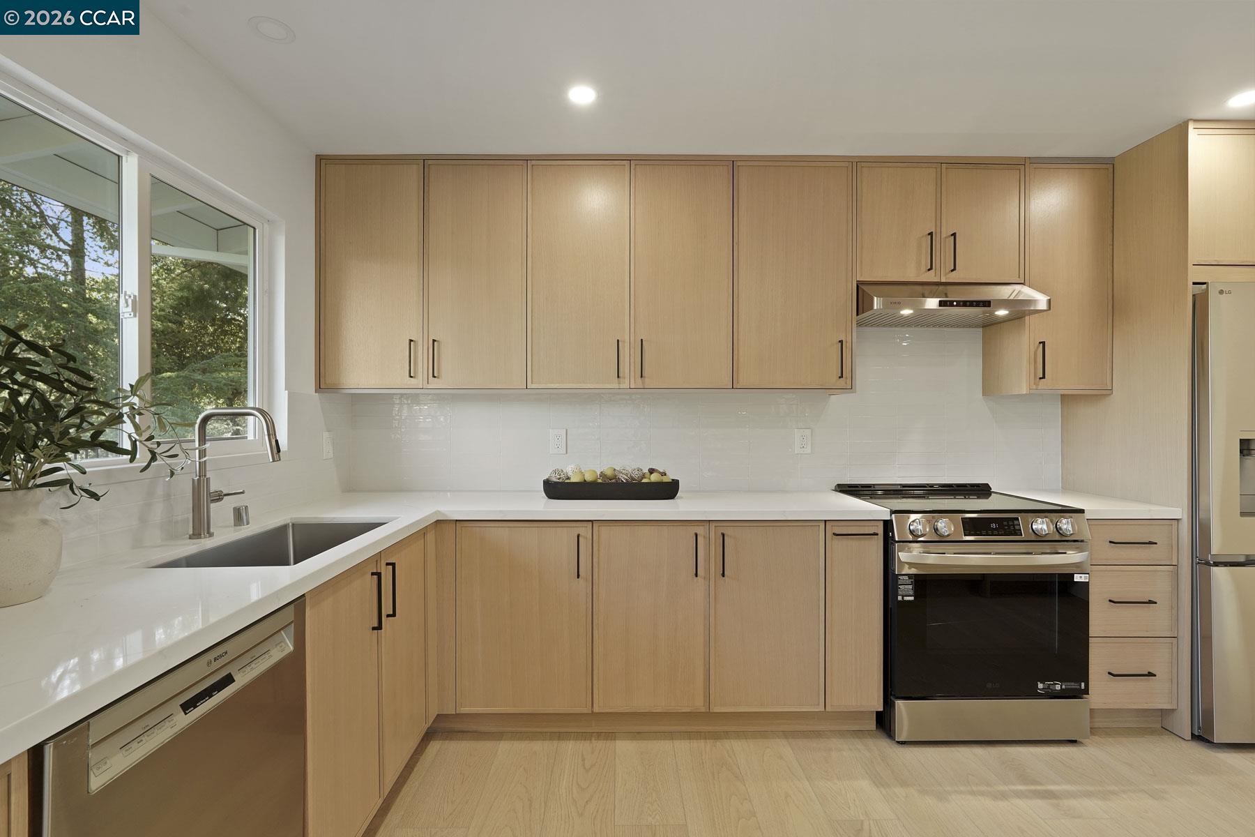 3233 Lucas Circle Lafayette, CA 94549 - Photo 17 of 59 a kitchen with a stove and a sink