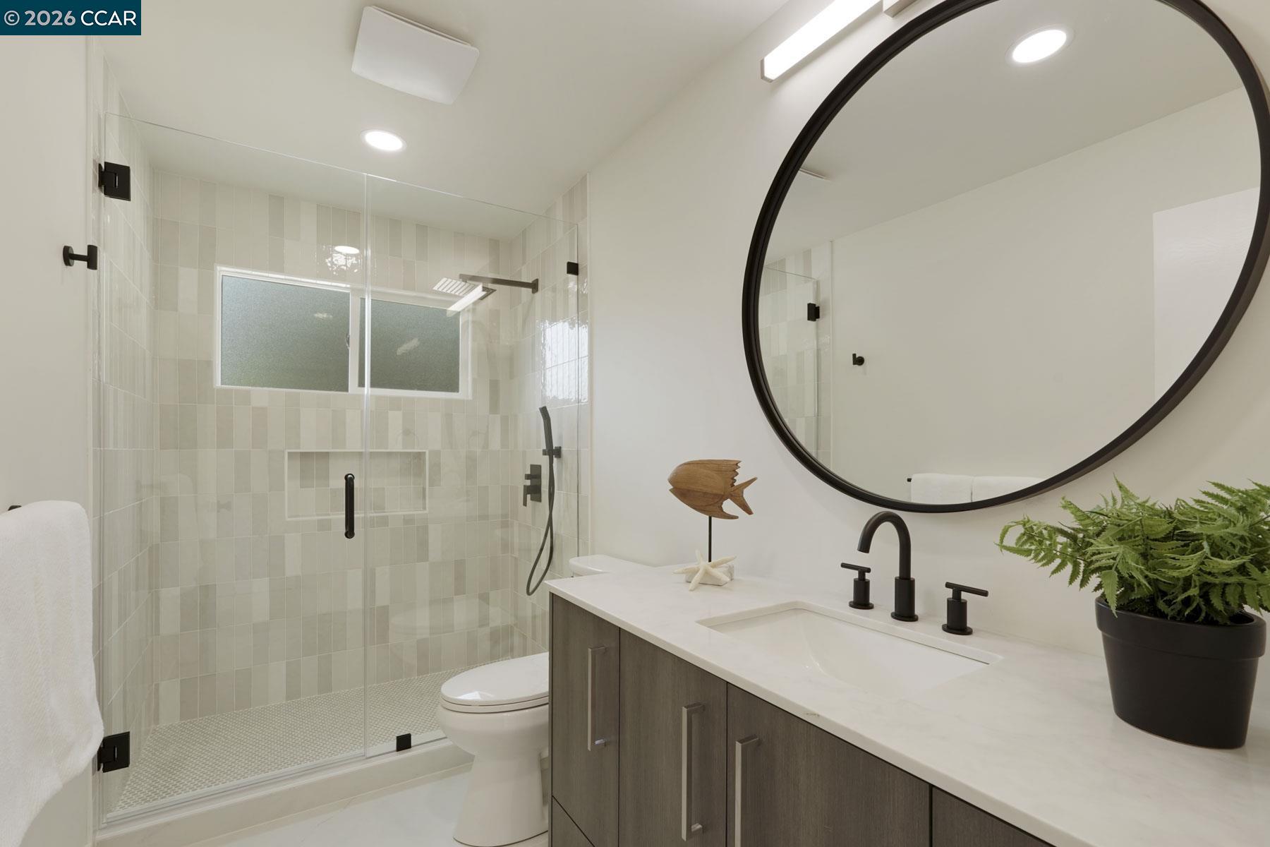 3233 Lucas Circle Lafayette, CA 94549 - Photo 4 of 59 a bathroom with a sink a toilet and a mirror