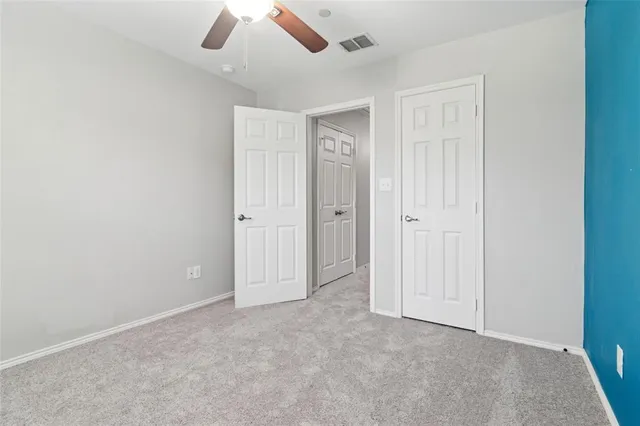 an empty room with closet area