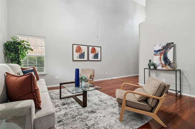 a living room with furniture and a rug