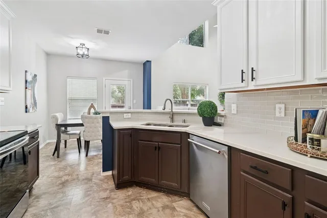 a kitchen with a sink and cabinets