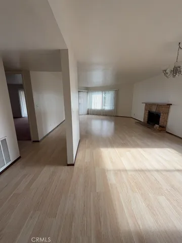 a view of a livingroom with wooden floor