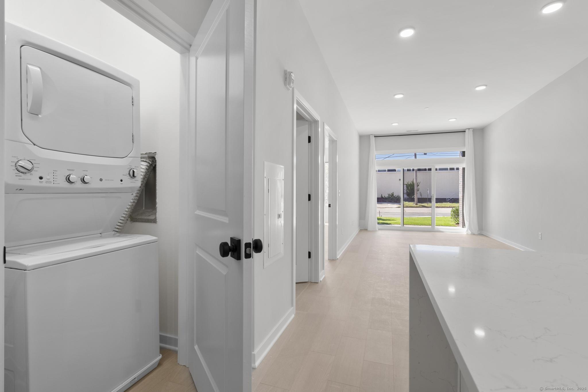 9 John Street Clinton, CT 06413 - Photo 16 of 18 a bathroom with a bathtub and a shower