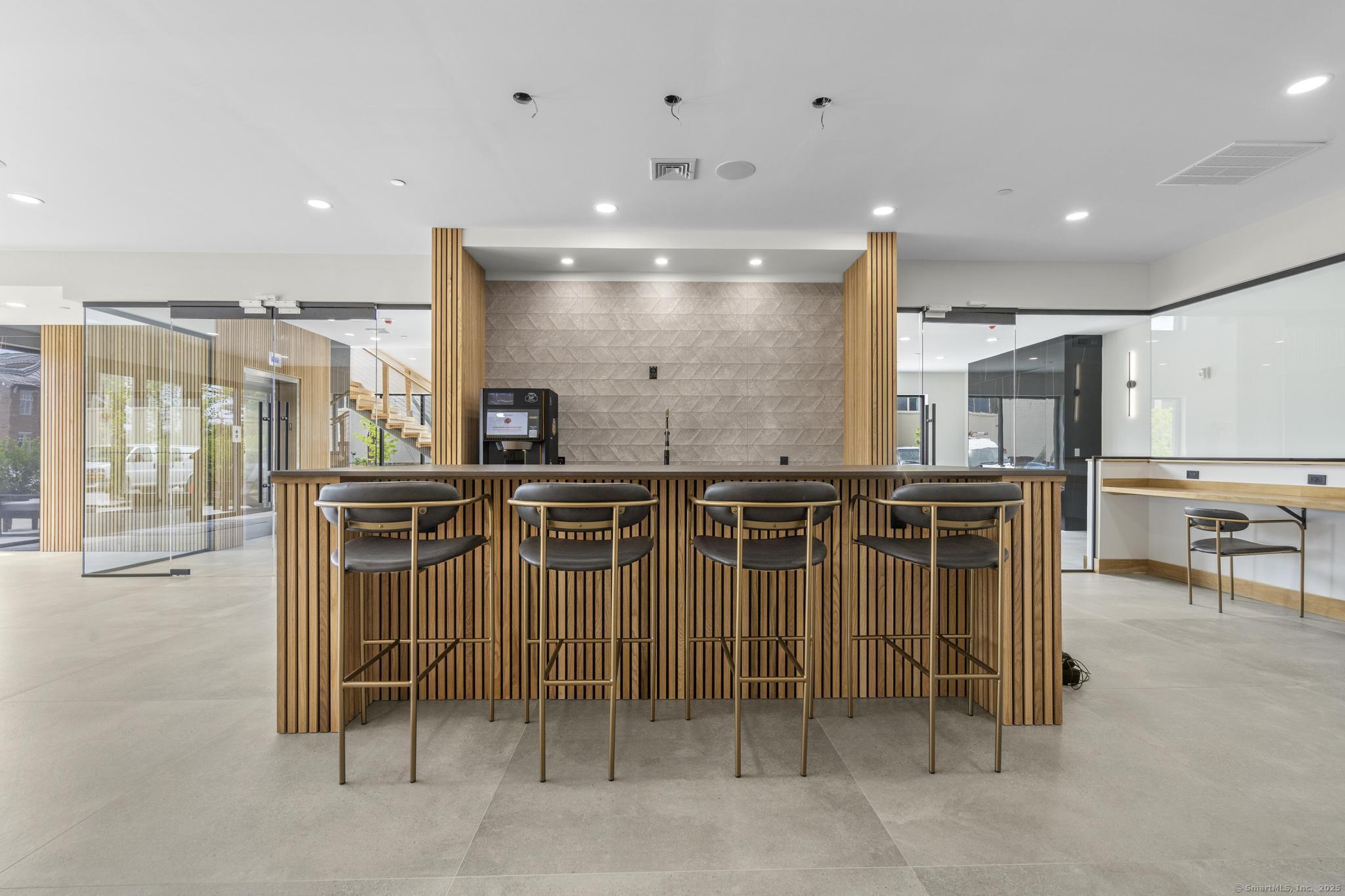 9 John Street Clinton, CT 06413 - Photo 8 of 18 a view of a kitchen with table and chairs