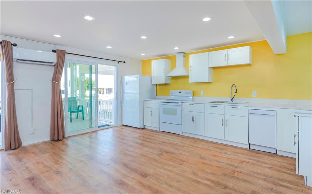 12277 Boat Shell Drive Matlacha Isles, FL 33991 - Photo 21 of 46 a view of a kitchen with wooden cabinet