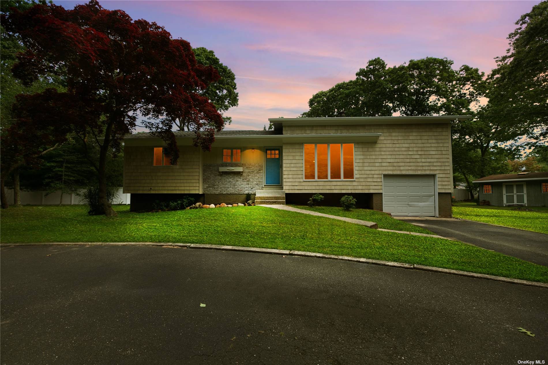 a house view with a garden space