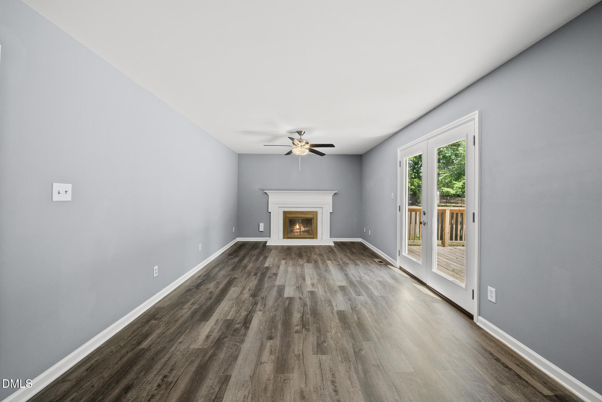 2108 Treverton Place Raleigh, NC 27609 - Photo 5 of 30 wooden floor in an empty room with a window