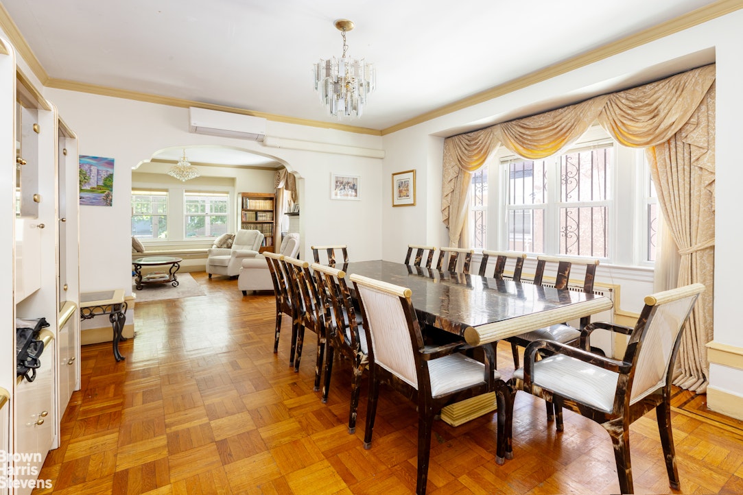 1917 Glenwood Road Brooklyn, NY 11230 - Photo 5 of 22 a view of a dining room and livingroom with furniture wooden floor a chandelier