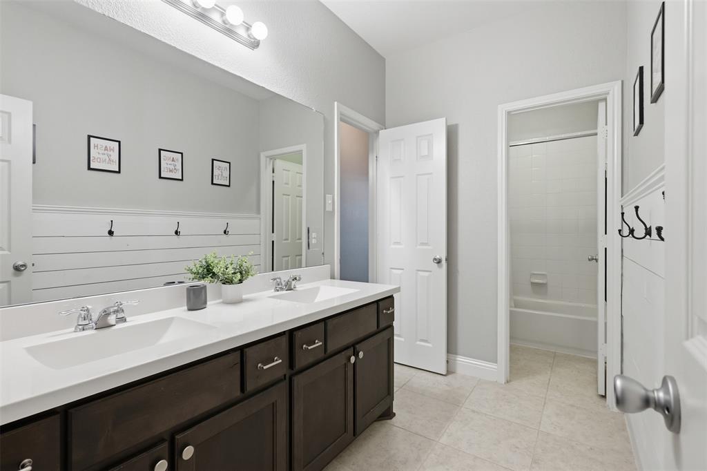 717 Allbright Road Celina, TX 75009 - Photo 24 of 37 Large full bathroom, double sinks and a separte shower