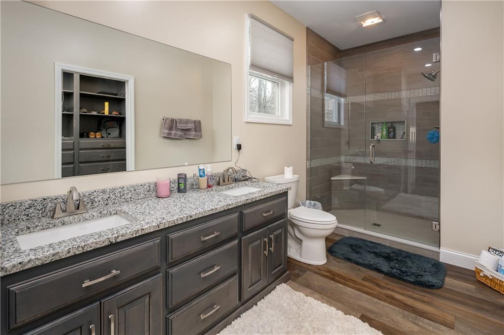 117 Dodds Road Butler, PA 16002 - Photo 15 of 25 a bathroom with a granite countertop sink toilet and shower