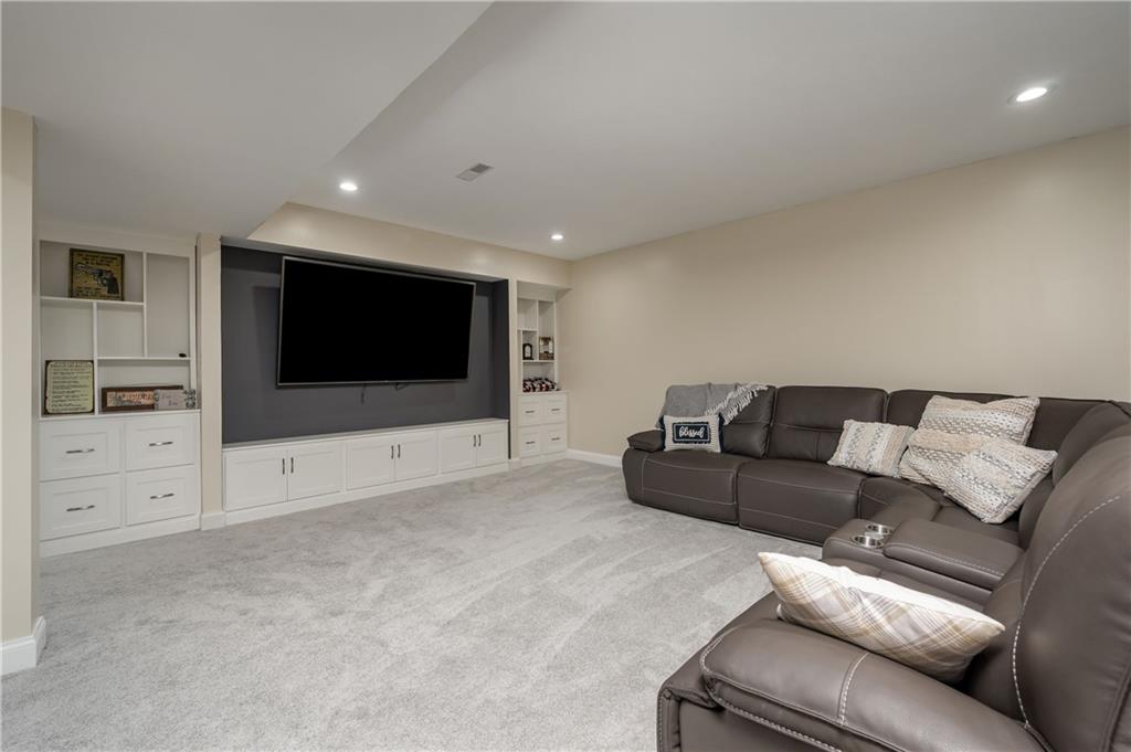 117 Dodds Road Butler, PA 16002 - Photo 18 of 25 a living room with furniture and a flat screen tv
