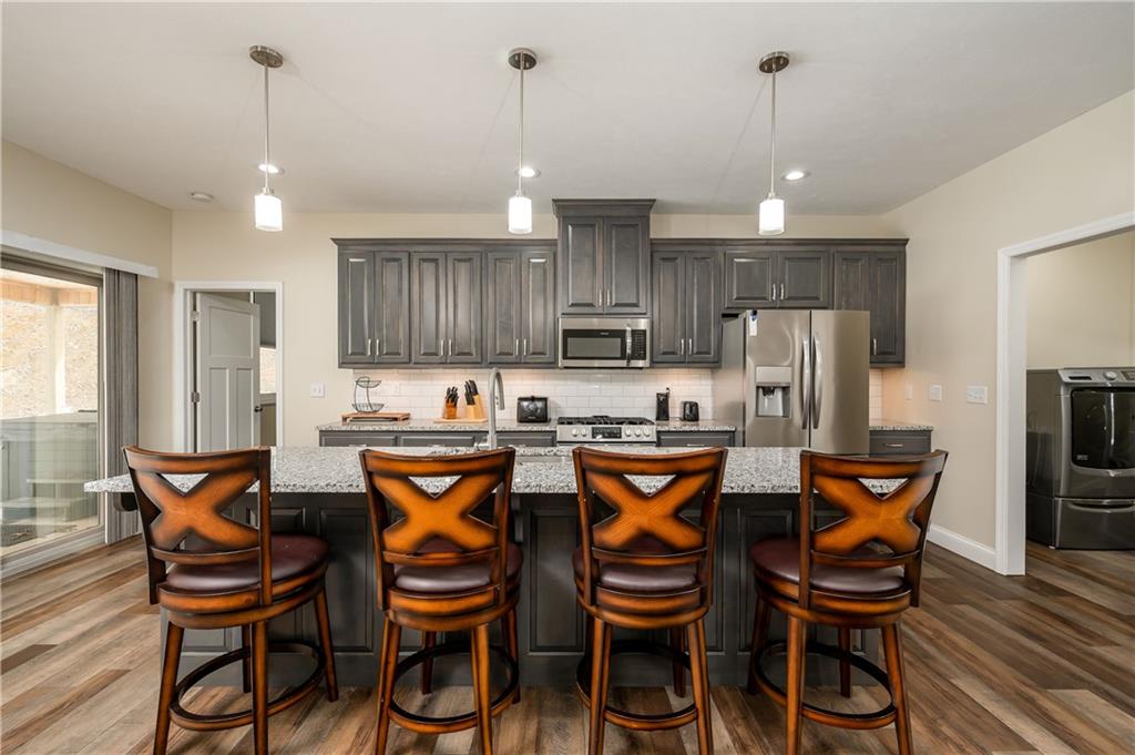 117 Dodds Road Butler, PA 16002 - Photo 10 of 25 a kitchen with granite countertop wooden cabinets and dining table