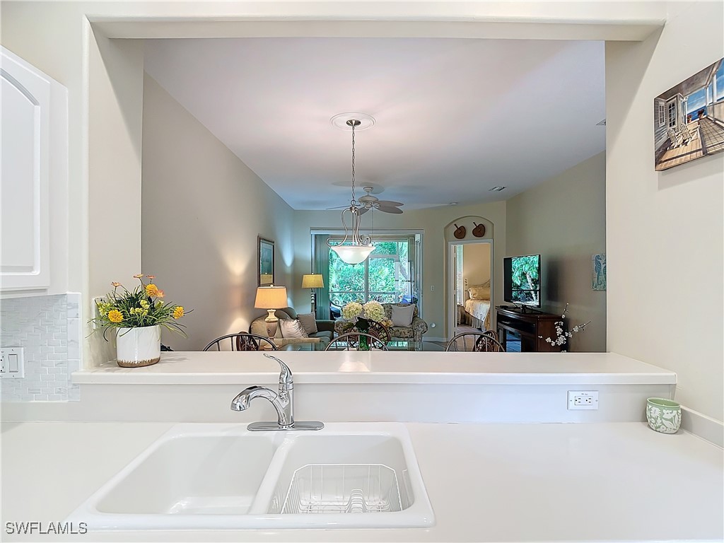 3600 Rue Alec Loop, Unit 4 North Fort Myers, FL 33917 - Photo 13 of 40 a bathroom with a sink a faucet a potted plant and a window