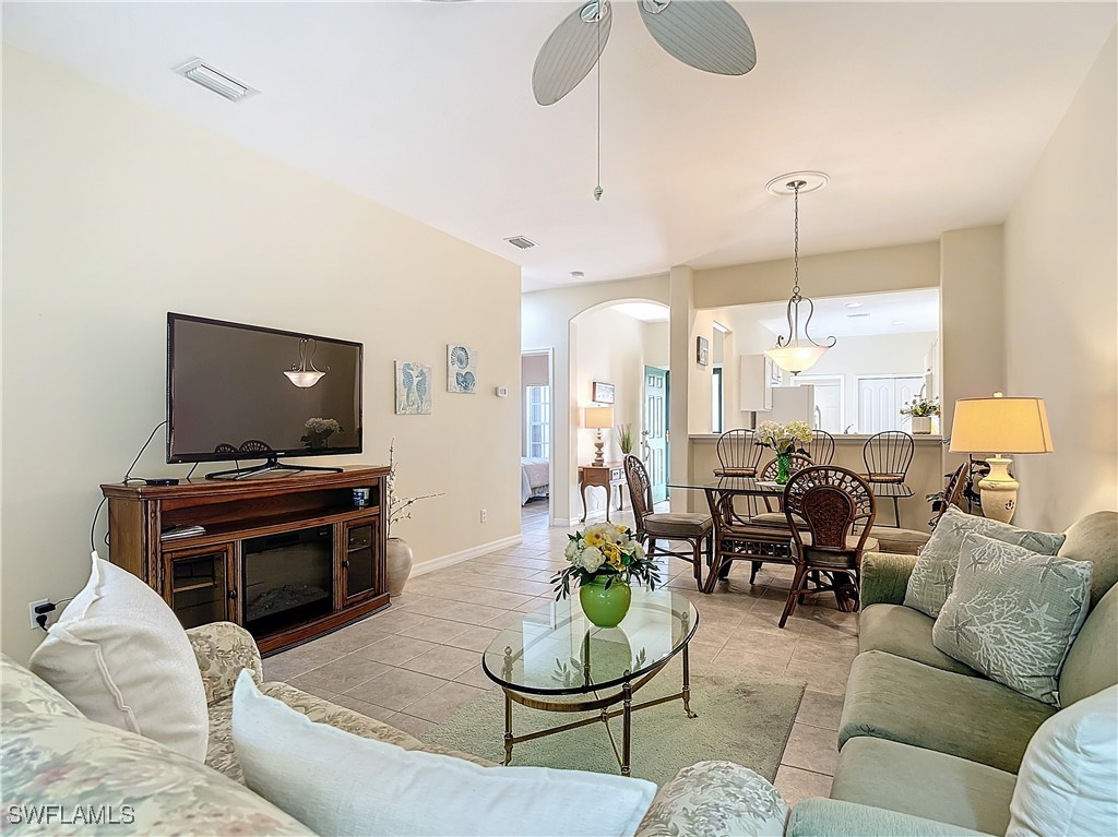 3600 Rue Alec Loop, Unit 4 North Fort Myers, FL 33917 - Photo 17 of 40 a living room with furniture and a flat screen tv