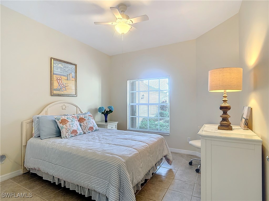 3600 Rue Alec Loop, Unit 4 North Fort Myers, FL 33917 - Photo 21 of 40 a bedroom with a bed and a window