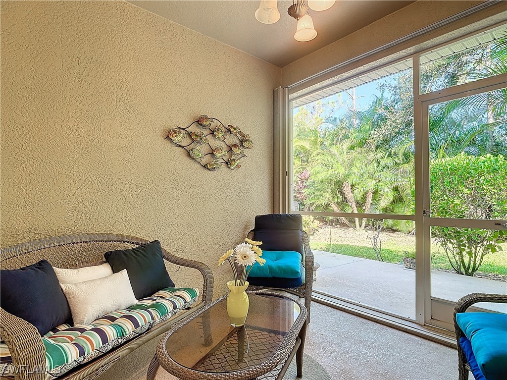 3600 Rue Alec Loop, Unit 4 North Fort Myers, FL 33917 - Photo 25 of 40 a living room with furniture and a large window with garden view