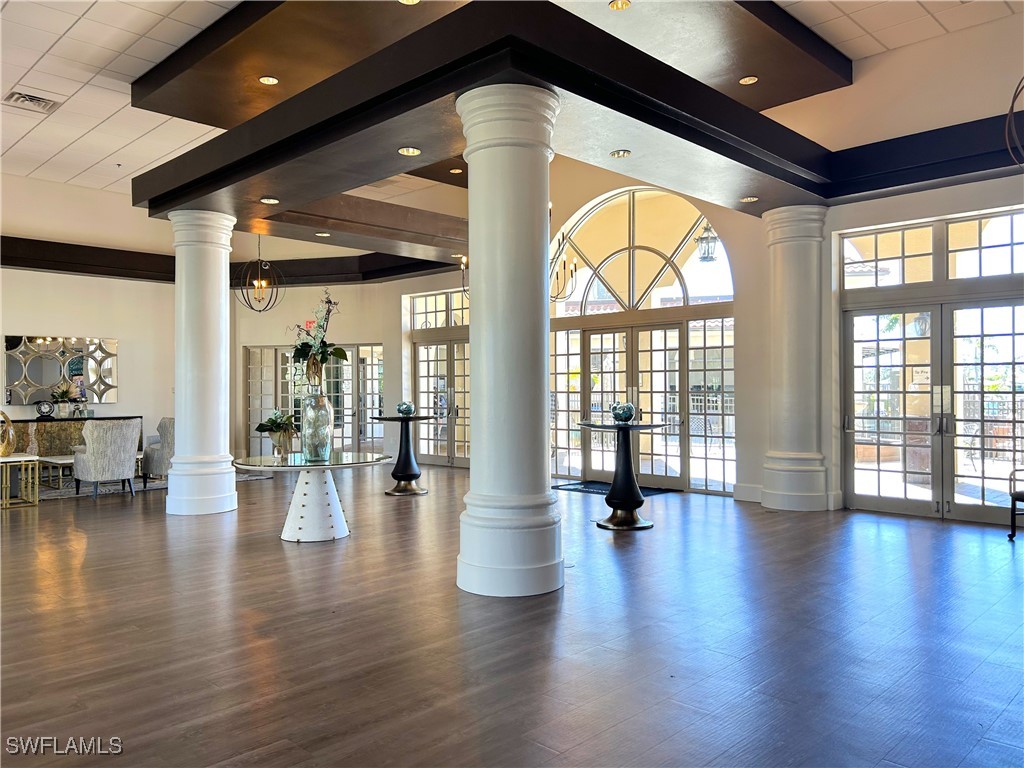 3600 Rue Alec Loop, Unit 4 North Fort Myers, FL 33917 - Photo 33 of 40 a view of an entryway with wooden floor and a floor to ceiling window