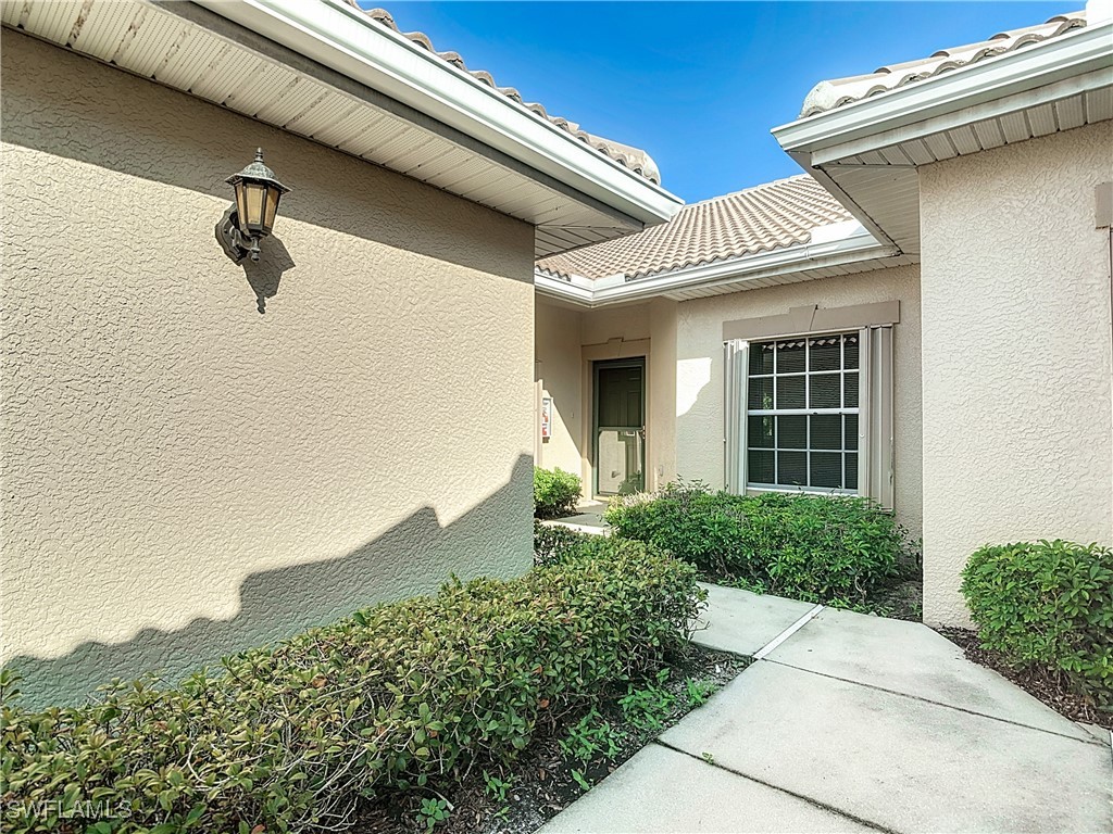 3600 Rue Alec Loop, Unit 4 North Fort Myers, FL 33917 - Photo 5 of 40 a view of a house with a yard