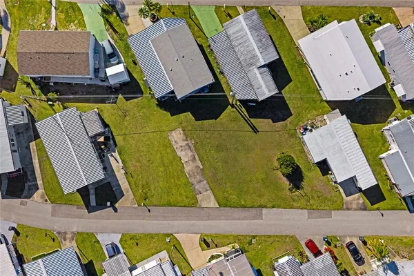 an aerial view of a house with a swimming pool