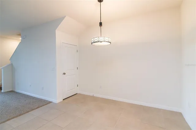 a view of a chandelier fan and closet in a room