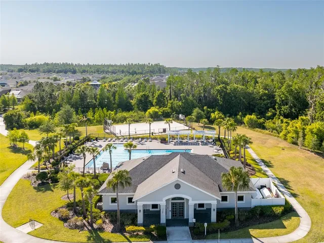 an aerial view of residential house with outdoor space and swimming pool