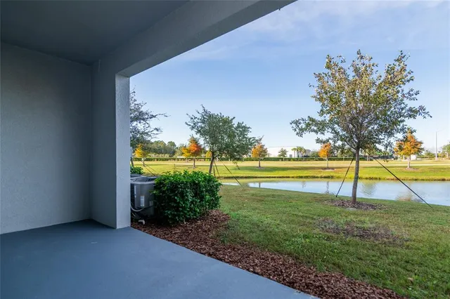 a view of a swimming pool with an outdoor space and seating area