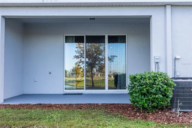 a view of a house with a small yard