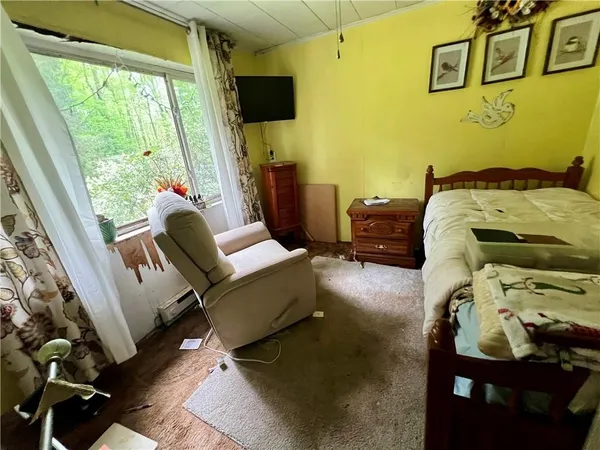 a room with window and furniture
