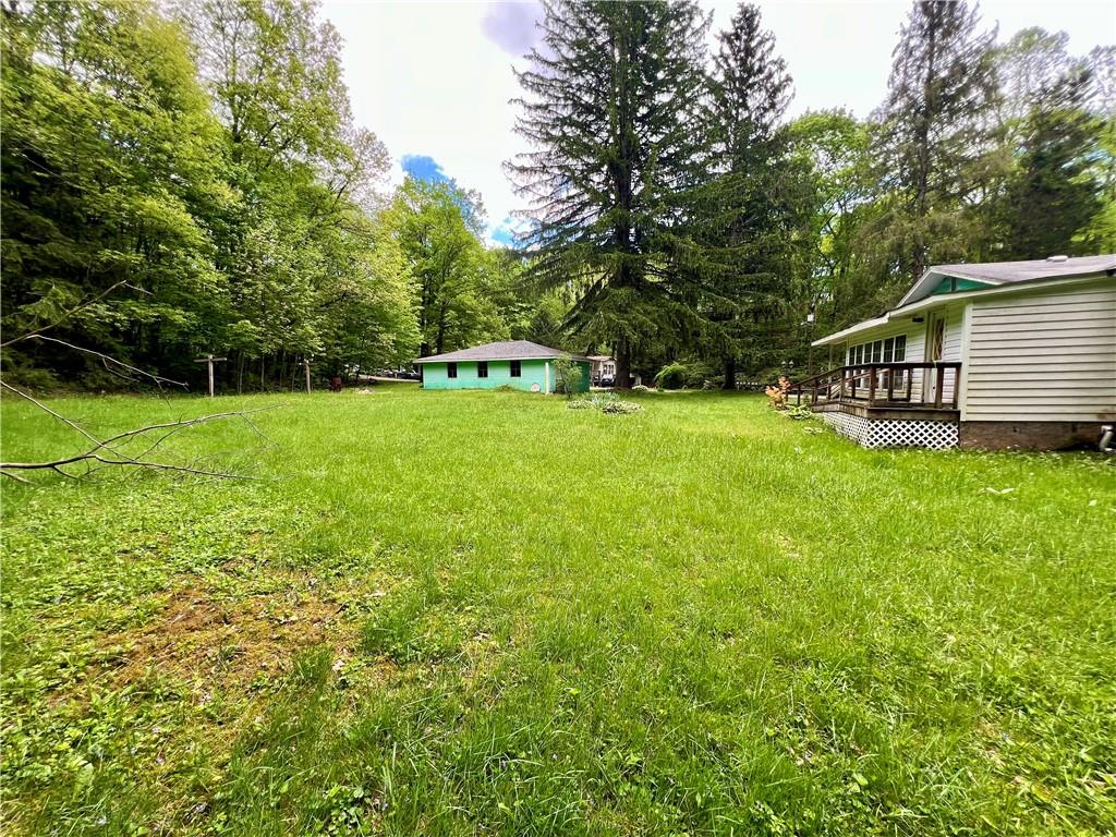 192 Hawkins Hollow Road Connellsville, PA 15425 - Photo 7 of 16 a view of a house with a yard and sitting area