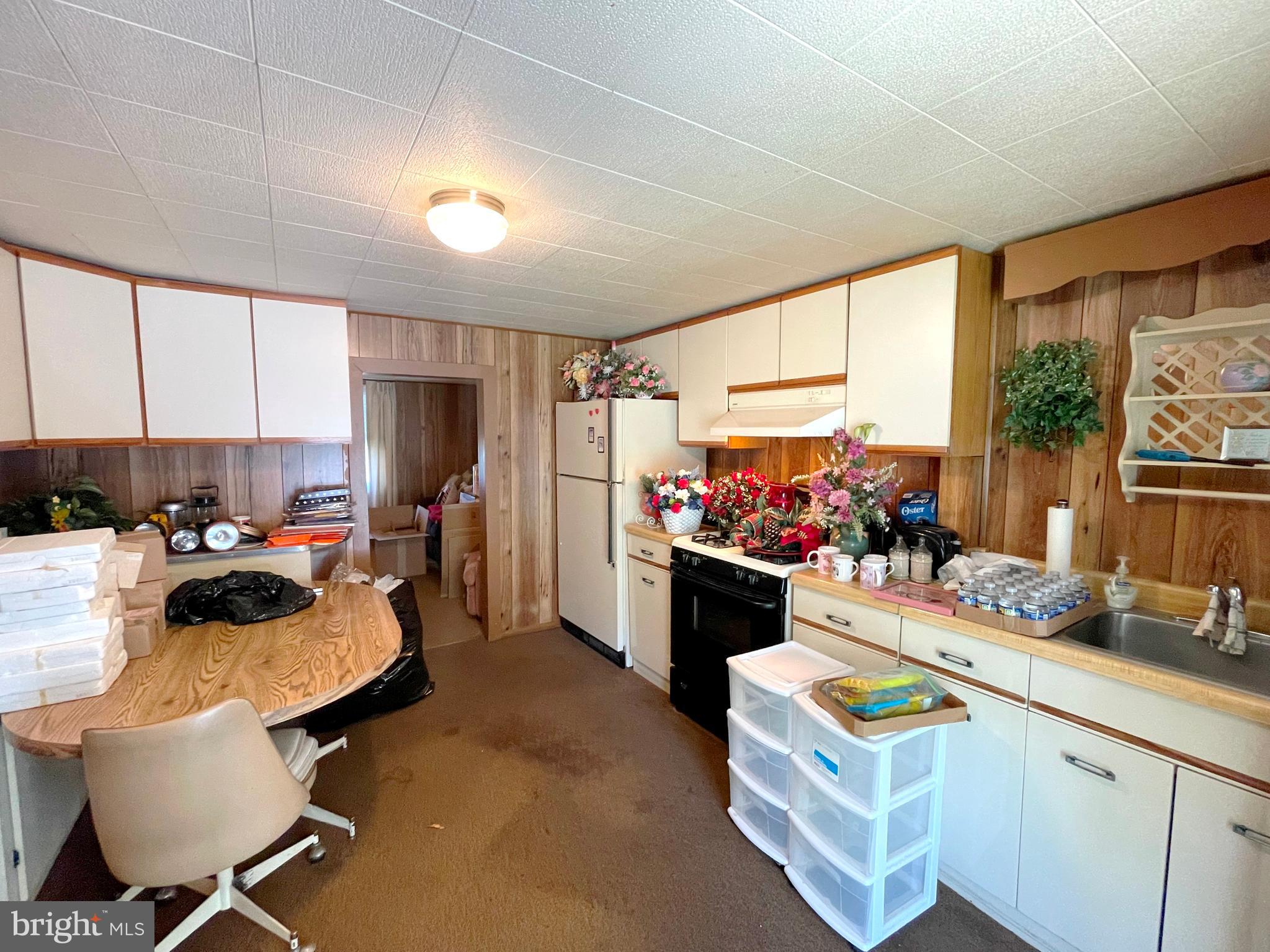 6700 Hungerford Road Bryans Road, MD 20616 - Photo 6 of 36 a room with furniture and a view of kitchen