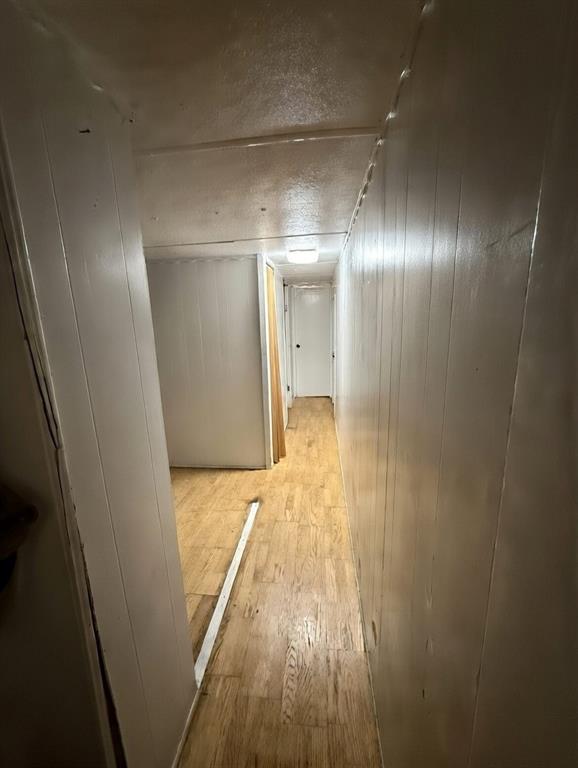 7443 Anderlan Road The Colony, TX 75056 - Photo 13 of 15 a view of hallway with wooden floor