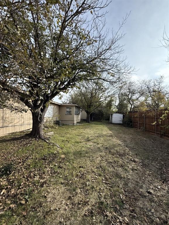 7443 Anderlan Road The Colony, TX 75056 - Photo 2 of 15 a view of a yard with a tree