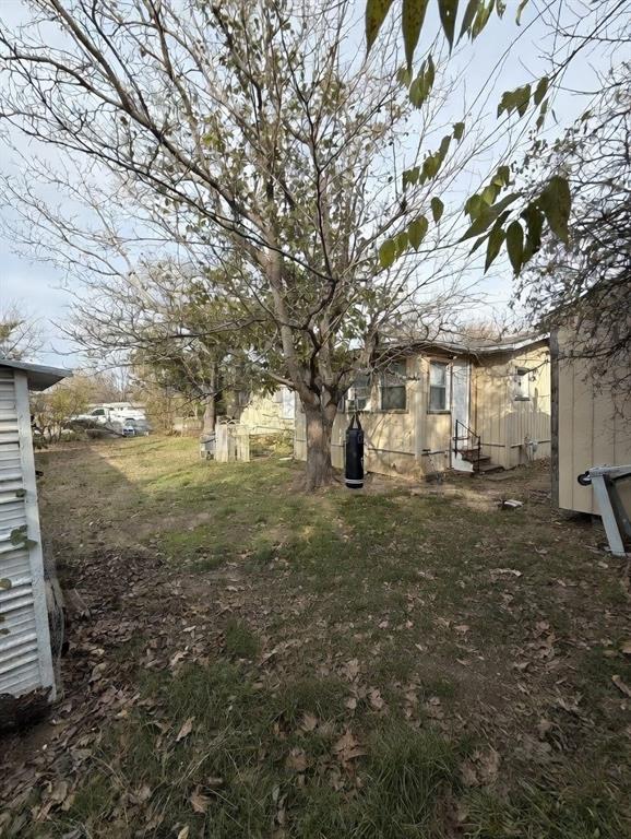 7443 Anderlan Road The Colony, TX 75056 - Photo 3 of 15 a view of a yard with table and chair