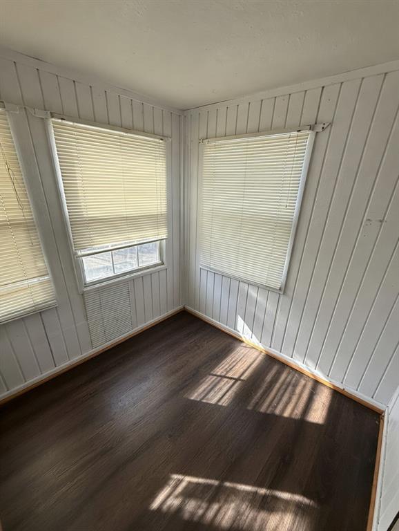 7443 Anderlan Road The Colony, TX 75056 - Photo 8 of 15 a view of an empty room with wooden floor and a window