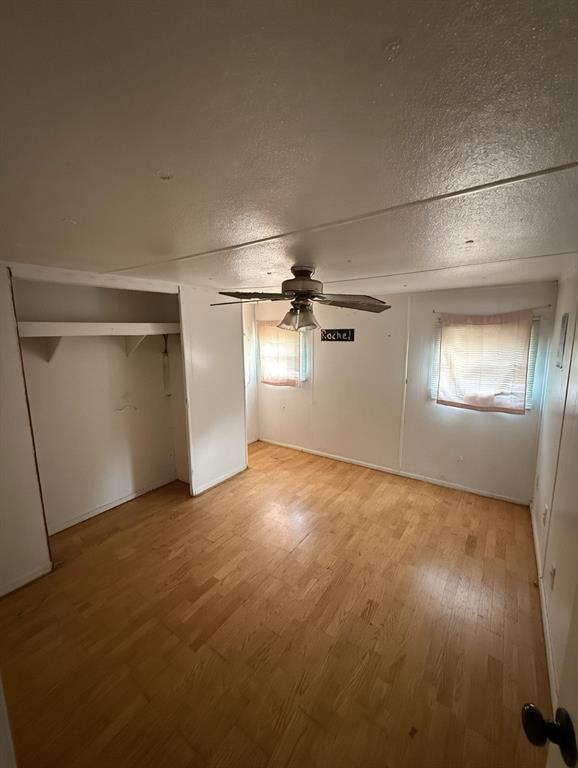 7443 Anderlan Road The Colony, TX 75056 - Photo 10 of 15 an empty room with windows and closet