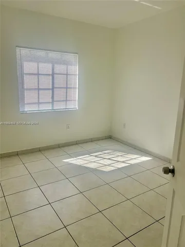 a view of a room with windows