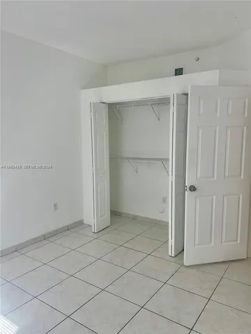 an empty room with cabinet