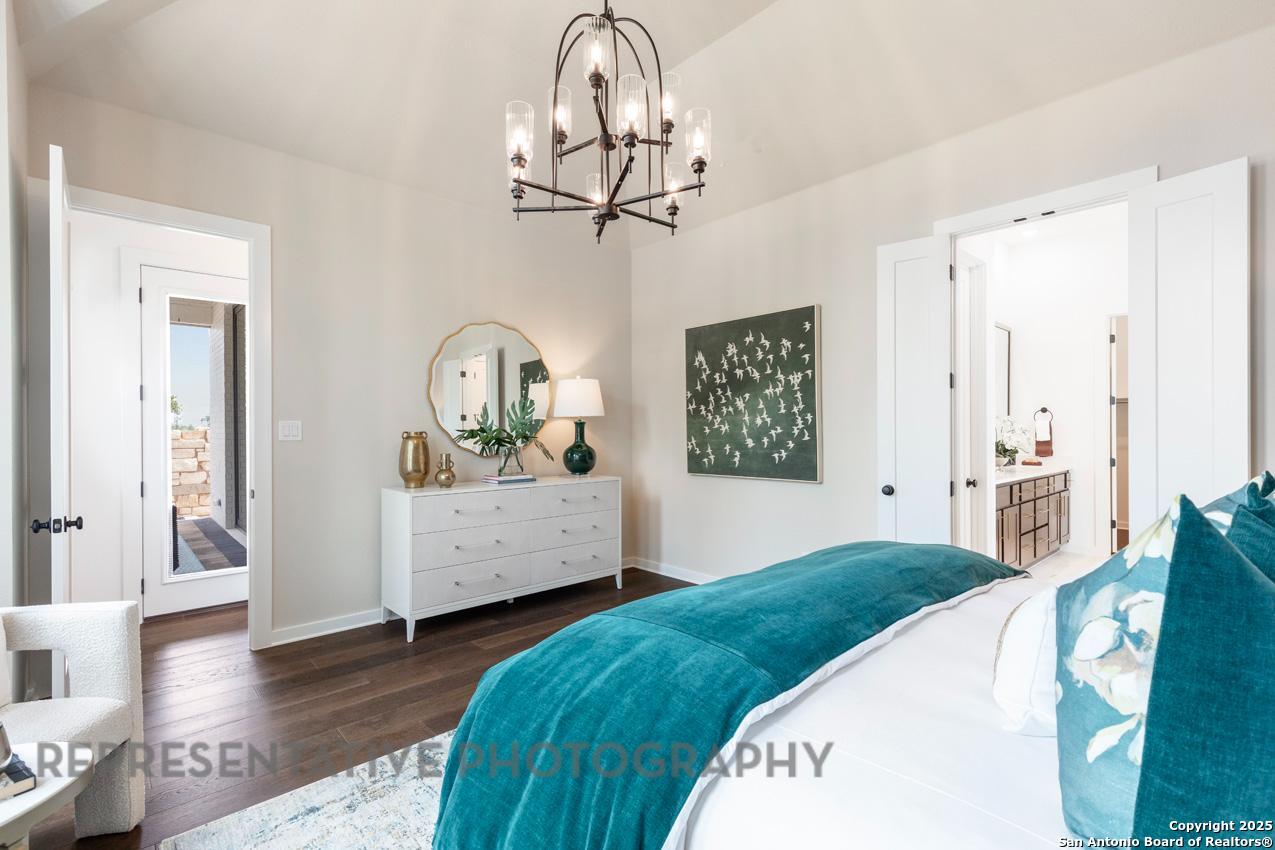 235 Boulder Creek Boerne, TX 78006 - Photo 16 of 40 a bedroom with a bed and window