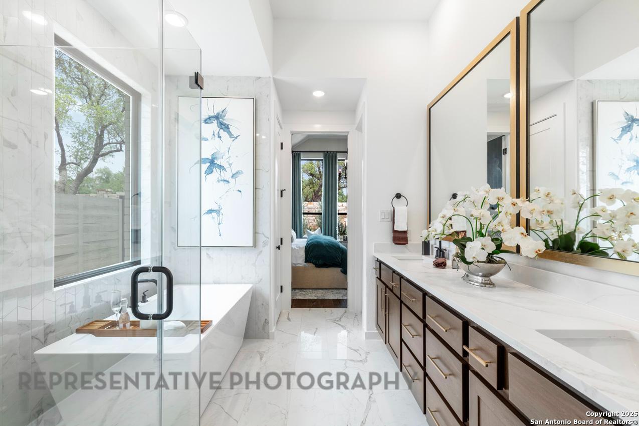 235 Boulder Creek Boerne, TX 78006 - Photo 18 of 40 a bathroom with sink and mirror