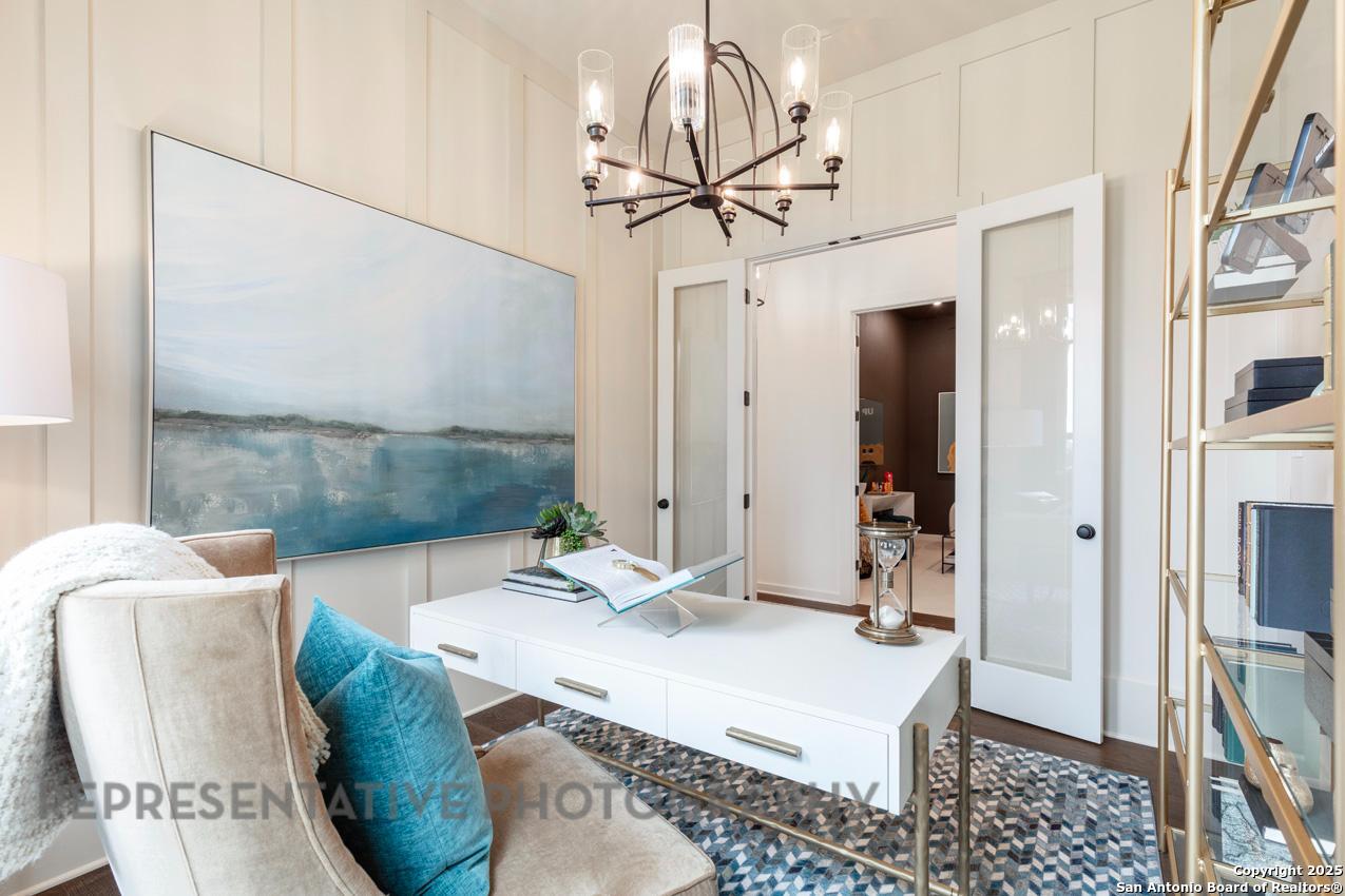 235 Boulder Creek Boerne, TX 78006 - Photo 21 of 40 a room with granite countertop furniture and a chandelier