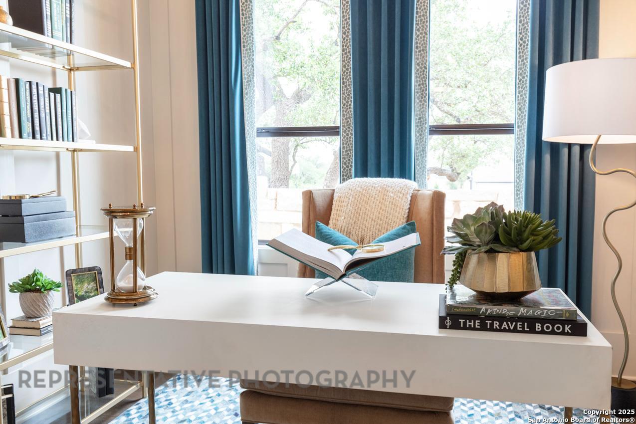 235 Boulder Creek Boerne, TX 78006 - Photo 22 of 40 a view of table and chair with potted plant