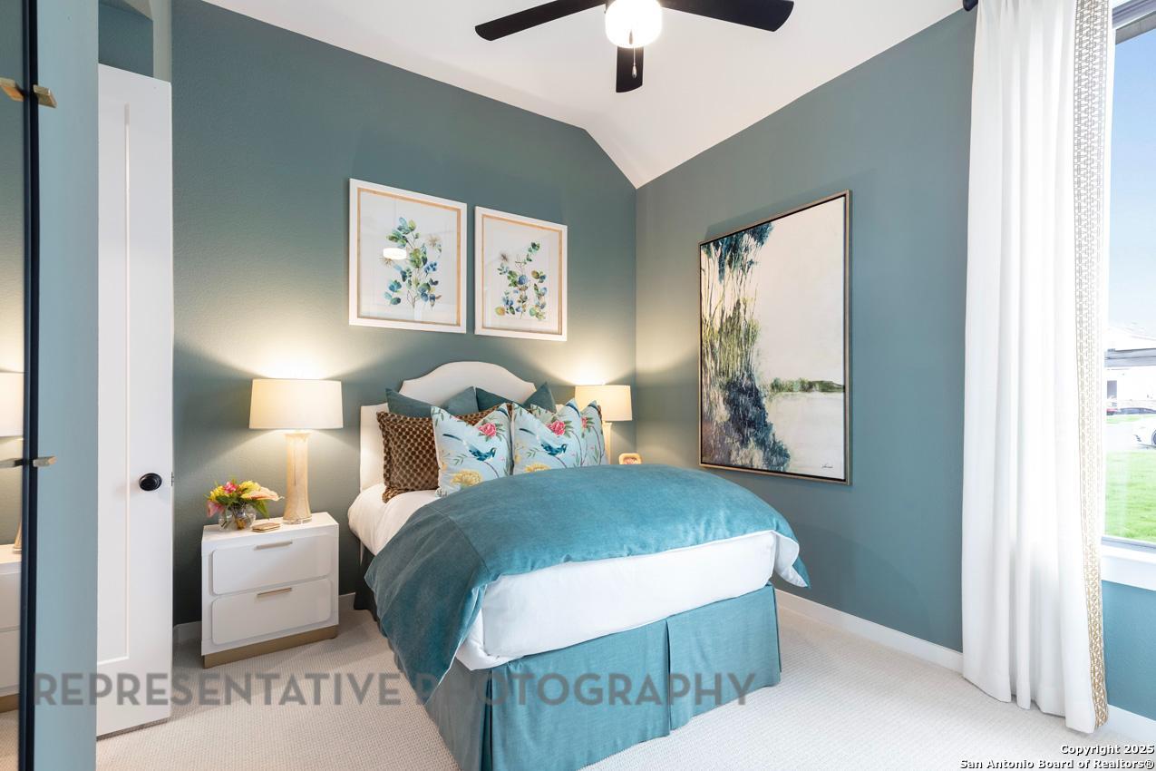 235 Boulder Creek Boerne, TX 78006 - Photo 28 of 40 a bedroom with a bed and a window