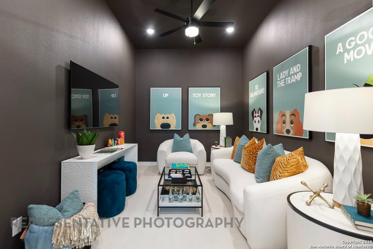 235 Boulder Creek Boerne, TX 78006 - Photo 32 of 40 a living room with furniture and a wooden floor