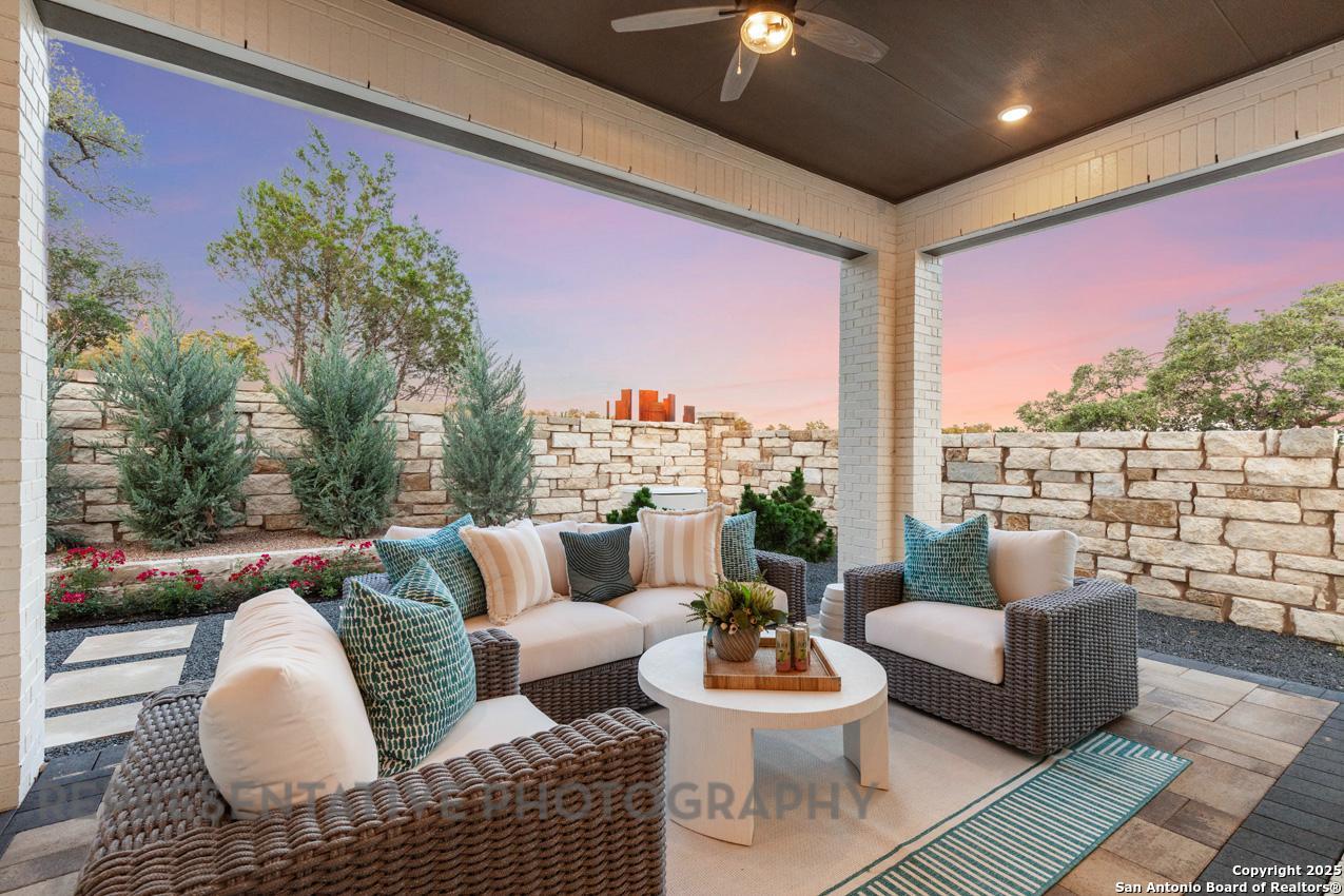 235 Boulder Creek Boerne, TX 78006 - Photo 35 of 40 a outdoor living space with patio furniture and a potted plant