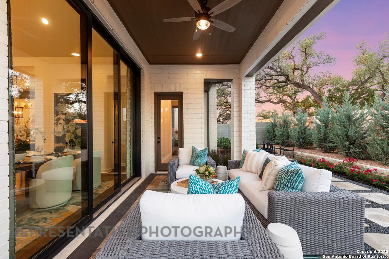235 Boulder Creek Boerne, TX 78006 - Photo 38 of 40 a living room with furniture and a floor to ceiling window