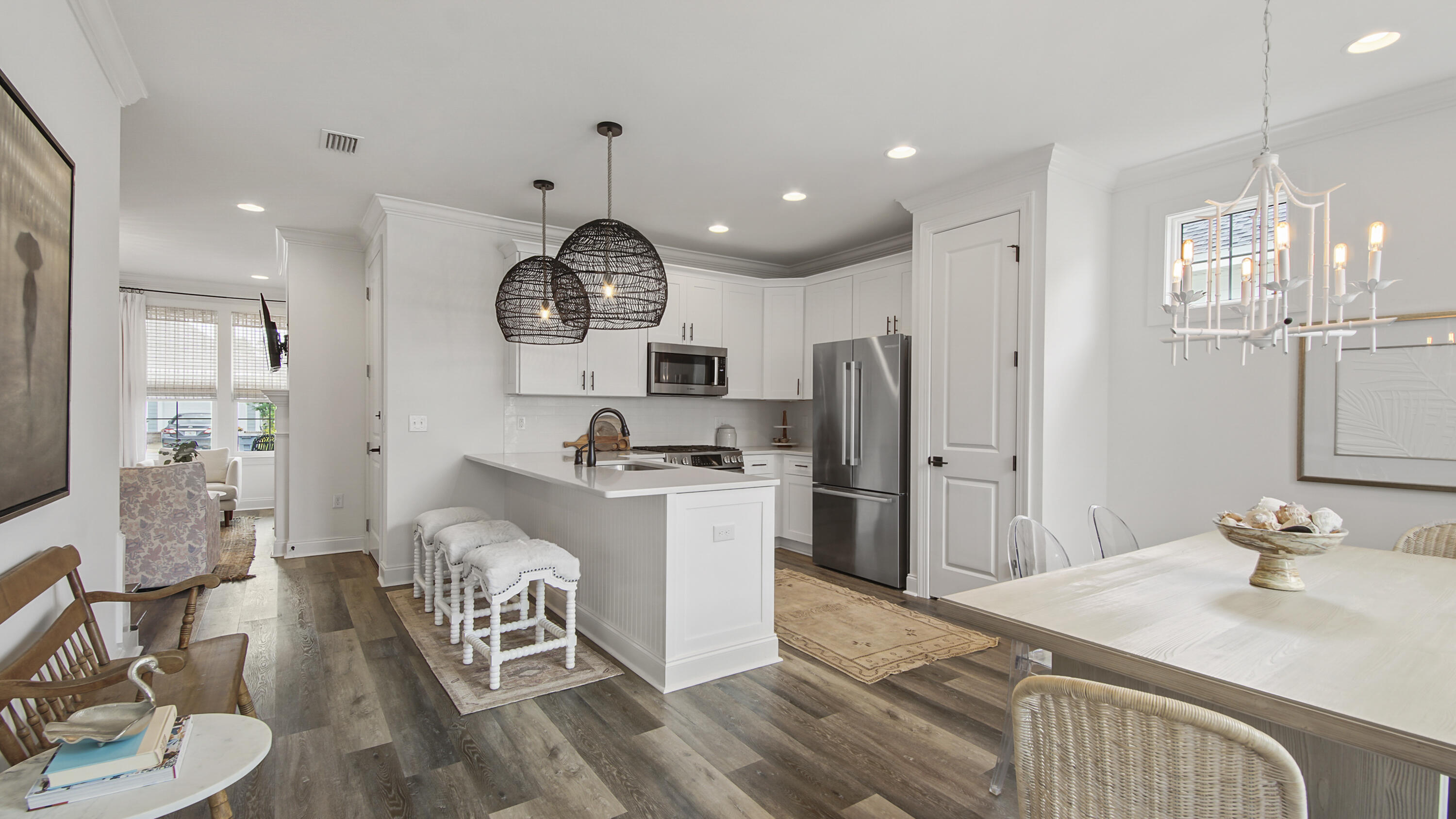 40 Conifer Ct Inlet Beach Inlet Beach, FL 32461 - Photo 6 of 25 a kitchen with stainless steel appliances kitchen island granite countertop a sink refrigerator stove and microwave